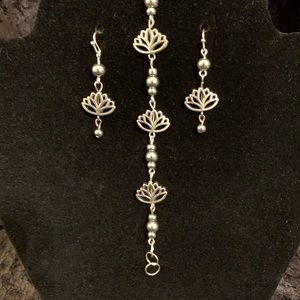 Matching silver lotus earrings and bracelet